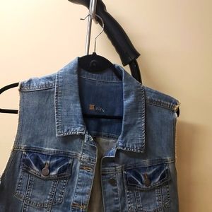 Distressed denim vest